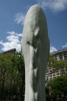 The statue has a braid going down the back.  Plensa modeled it after the nine-year-old daughter of a restaurant owner in his hometown of Barcelona.
